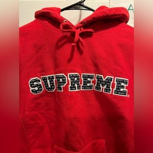 Supreme “Who Is F****** Us Over The Most” Hoodie
